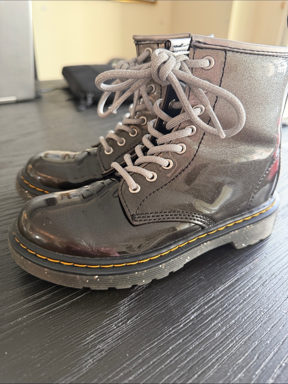 Dr. Martens Kids Black Patent Lace-Up Boots with Yellow Stitching